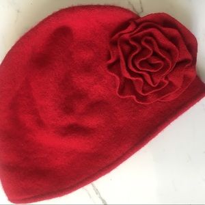 Red winter hat with flower